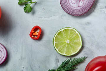 Chopped onion, red hot pepper and spice isolated on white background, top view, close-up, selective focus
