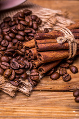 Coffee beans on old wooden table. Vintage style