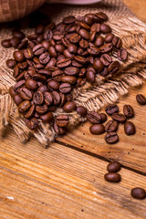Coffee beans on old wooden table. Vintage style