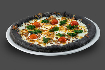 Italian pizza from full grain flower with cherry tomatoes, cheese and basil