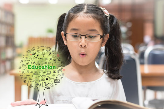 Innovative stem education and tree of knowledge concept with kid reading book in library