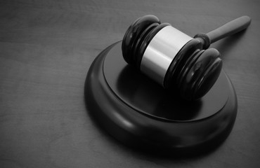 Gavel on wooden table with copyspace, law concept