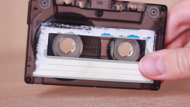 Old tape cassette in hand