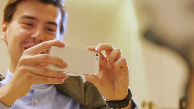 Man Takes Photo Active Person on Modern Smartphone