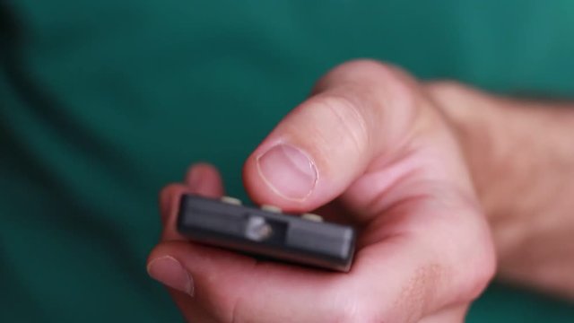 Remote control in man's hand close up