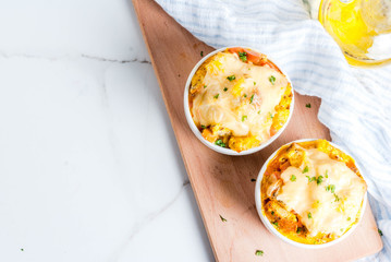 Homemade Homemade italian bread casserole strata with cheese, egg and ham, white background copy...