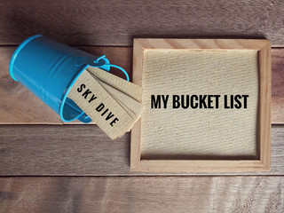 Inspirational and conceptual - ‘My bucket list ‘ written on a white framed paper. With vintage...