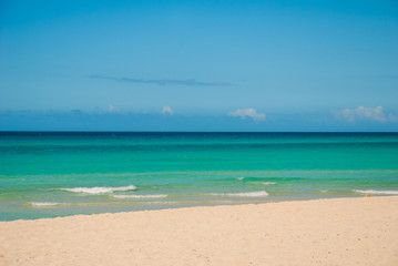 Tourists relax on Varadero sandy beach.Paradise landscape with turquoise sea and white sand. Cuba