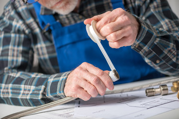 Plumber using seal tape