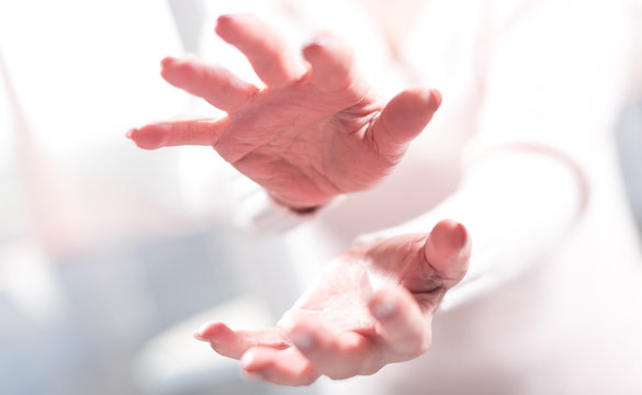 Hands of woman in gesture of protection