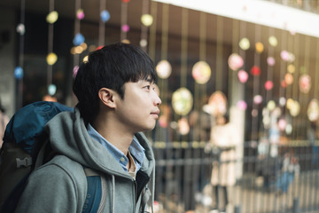 Young man traveling in Korea, Seoul Street