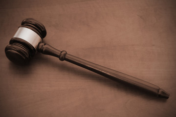 Wooden gavel on brown wooden table 