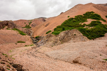 Icelandic landscape with red hills in Lonsoraefi