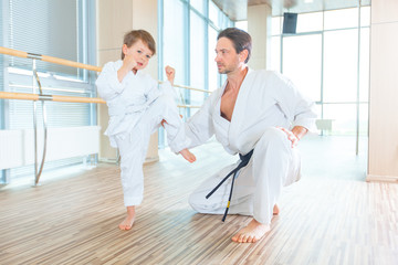 Obraz premium young, beautiful, successful multi ethical kids in karate position