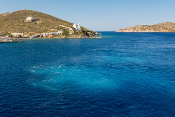 Blue sea water of Aegean Sea surrounded by beautiful coast of Island of Ios. Greece.