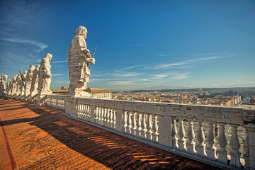 Fototapeta premium Row of saints located on the balcony of St. Peter's Basilica, Vatican, Rome, Italy.