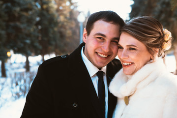 Winter bright wedding bride and groom couple