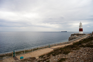 Gibraltar seen from Alcaidesa, Andalusia, Spain. Alcaidesa beach, beautiful panorama with the Rock of Gibraltar in the background. Campo de Gibraltar natural scenery. Mediterranean Sea, cloudy sky.