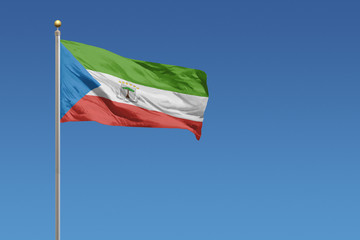 Equitorial Guinea Flag in front of a clear blue sky