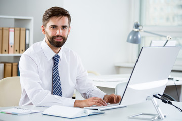 Fototapeta premium Businessman working in an office