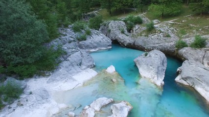 AERIAL view: flight over mountain river Soca. Camera flying forwards