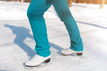 Female figure skates on the ice