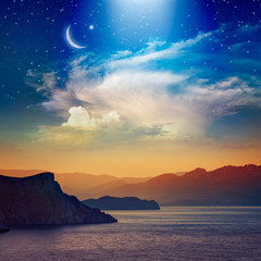 Ramadan Kareem background with crescent, stars and glowing clouds
