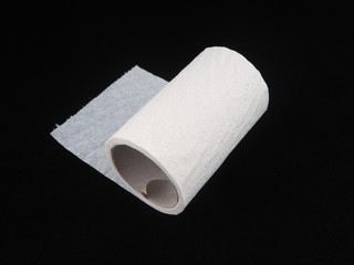 toilet paper on a black background