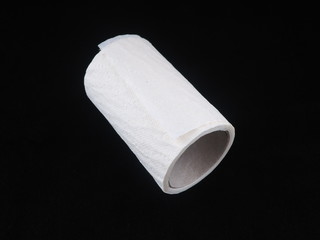 toilet paper on a black background