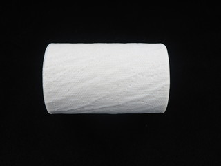 toilet paper on a black background