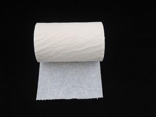 toilet paper on a black background