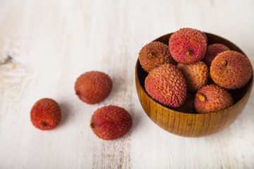 Lychee in a wooden bowl