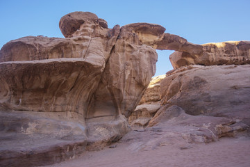 Wadi Ram desert stone bridge. Jordan landscape. Rock arch.