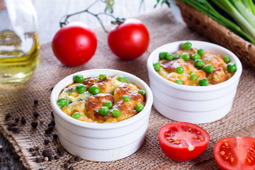 Casseroles with zucchini and green peas