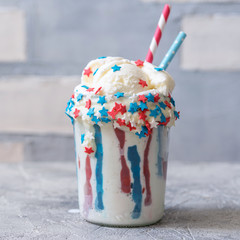 Obraz premium Vanilla funfetti milkshake with ice cream. Patriotic drink cocktail