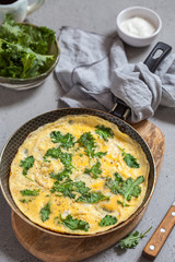 Omelette with baby kale leaves