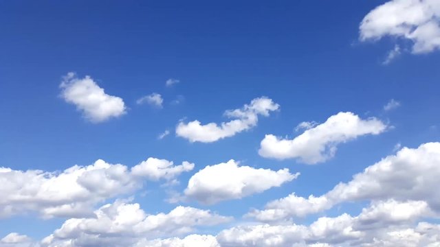 white clouds on blue sky moving timelapse