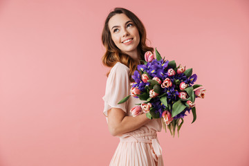 Portrait of a delighted young girl in dress