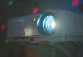 Movie projector in action mounted on the wall.