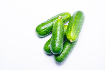 green cucumbers fresh on a white background