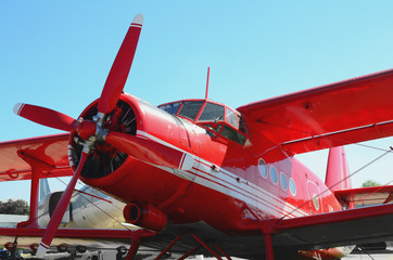 Big red airplane with white stripes