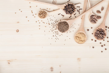 spices and herbs on kitchen wooden table background with copy space for text. food, cooking and restaurant concept. flat lay composition, top view