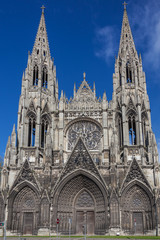 Fototapeta na wymiar Remarkable gothic Notre Dame Cathedral in Rouen on blue sky background, Normandy, France