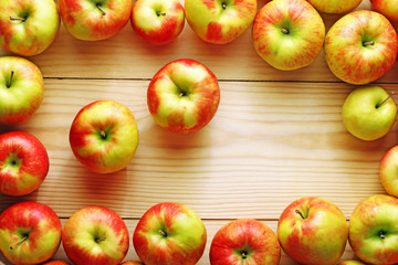 red apples on a wood background