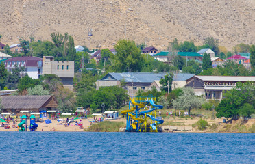 People enjoy hot weather near Cholpon-Ata, Issyk-Kul lake, Kirghistan 30.07.2017