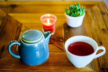 Red Fruit Tea on wood table with bokeh 