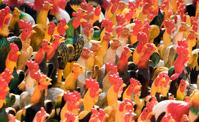 Colorful of a many chicken statues at Buddhist temple, Thailand.