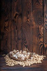 Obraz na płótnie Canvas peanuts on wood background
