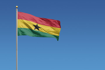 Ghana Flag of in front of a clear blue sky