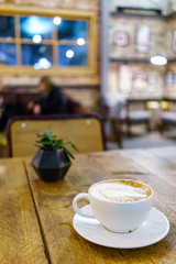 Caffe Latte with wooden background